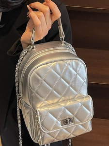 Chic silver quilted mini backpack with metallic finish and metal chain straps
