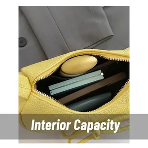 Yellow leather dumpling bag with bow, showing spacious interior for essentials