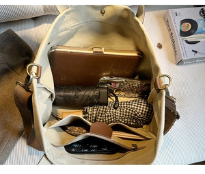 Top view of large capacity canvas tote bag showing organized interior and multiple pockets