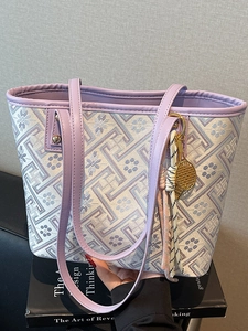 Chic purple and beige geometric woven tote bag with tennis racket charm and tassels
