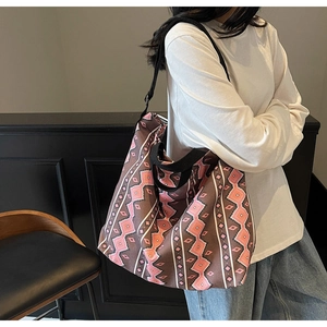 Detail of large canvas tote bag with pink geometric ethnic pattern and dual straps