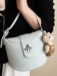 Light blue lychee leather shoulder bag with silver twist lock and cute bear charm
