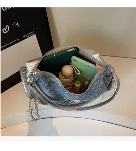 Internal view of a large denim tote bag showing space for tablets and daily essentials