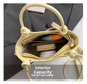 Top view showing the spacious interior with zipper pocket of this pale yellow bucket bag