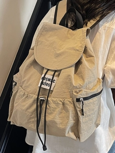 Japanese style minimalist nylon drawstring backpack in beige for travel and students