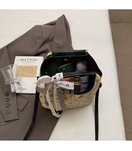 Detailed view of spacious interior of the beige bucket bag with bear print and ribbon