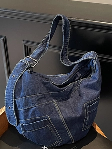 Large blue denim hobo bag with pockets and adjustable strap for casual daily commuting