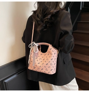 Detail of pink tote bag with bear print and stylish black and white checkered scarf