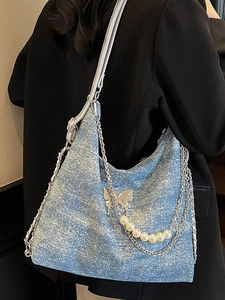 Blue denim tote bag with silver chain, pearl strap and butterfly pendant for women