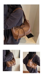 Close-up detail of a brown PU leather shoulder bag with a stylish bow decoration