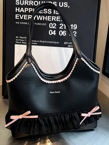 Sweet black tote bag with pink ruffles and bows for a chic aesthetic look