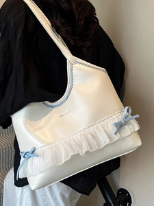Sweet cream tote bag with blue bow details and organza ruffle trim for summer fashion