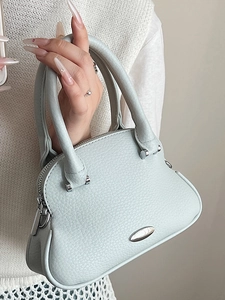 Stylish light blue shell-shaped handbag with litchi grain texture and silver hardware