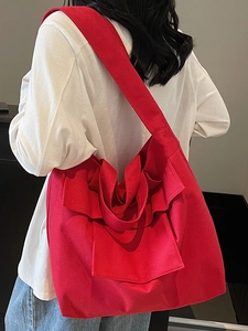 Stylish large red canvas tote bag with ruffled pleat details for fashion commute