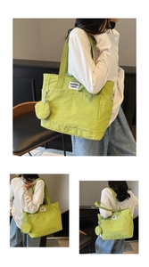 Detail of green nylon tote bag with small round pouch and waswac rules woven label