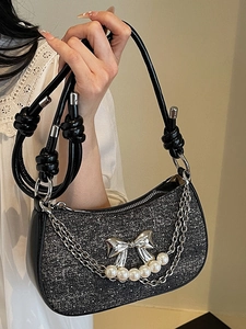Sparkly black sequin underarm bag with silver bow and pearl chain handle