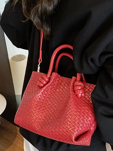 Red woven leather bucket bag with knotted handles and long strap for women's daily fashion