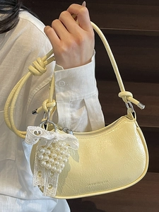 Minimalist light yellow wrinkled dumpling bag with lace bow and pearl heart charm