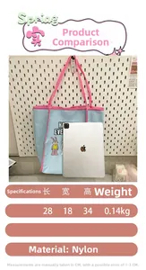 Detail view of light blue nylon tote bag with cartoon rabbit and dimensions 28x18x34cm