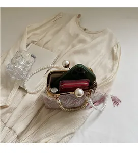 Detail view of the spacious inner compartment of the embroidered retro pearl handbag