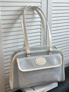 Chic light blue underarm tote bag with white trim and spacious commuter design
