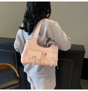 Borsa tote rosa in pelle PU con fiocco laterale in pizzo e tasche con fibbie metalliche