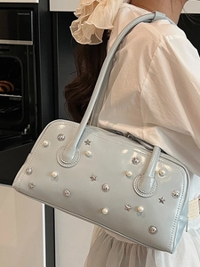 Light blue patent leather shoulder bag with decorative pearls and metallic stars