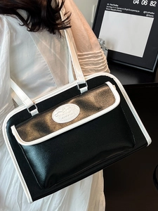 Minimalist black and white contrast leather shoulder bag for chic summer commuting