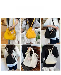 Vues multiples de sacs fourre-tout en nylon en jaune, noir et beige minimaliste