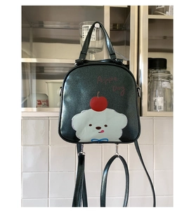 Détail du mini sac à dos vert foncé pailleté avec motif chien mignon Apple Dog