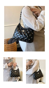 Detail of black quilted chain bag with silver star buckle and rhinestone accents
