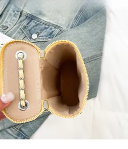 Detailed macro view showing the internal capacity and smooth zipper of the yellow quilted bag