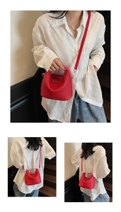 Three-way view of red lychee pattern leather bucket bag carried by model on stairs