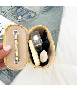 Detailed internal view showing the storage capacity of this yellow mini crossbody bag