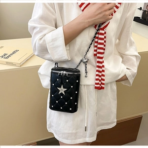 Black quilted cylinder shoulder bag with rhinestone star and silver bear chain strap