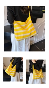Detail of yellow and white striped mesh tote bag with wooden toggle closure for summer