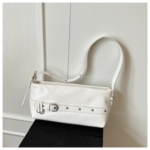 Detail of off-white minimalist underarm bag with glossy wrinkled texture and silver eyelet belt