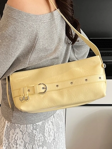 Minimalist bright yellow rectangle shoulder bag with eyelet strap and metallic buckle