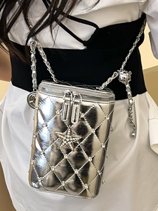 Silver metallic quilted crossbody bag with rhinestone star and adjustable chain strap