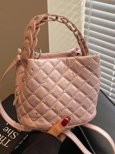 Pink quilted bucket bag with rhinestones and elegant woven chain handle for women