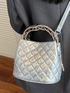 Silver quilted bucket bag with rhinestones and woven metal handle for women