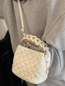 Quilted off-white bucket bag with sparkling diamonds and metal ring handle for women