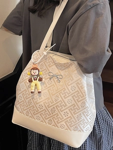 Chic retro tote bag in cream white featuring floral geometric prints and a cute charm