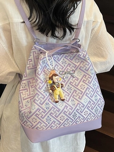 Lilac bucket backpack with traditional jacquard patterns and cute plush keychain