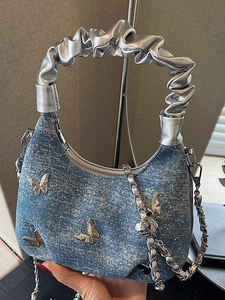 Y2K blue denim crossbody bag with silver butterfly charms and metallic pleated handle