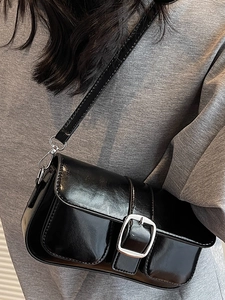 Minimalist black patent leather underarm bag with silver buckle and dual front pockets