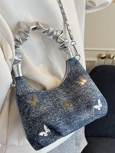 Blue denim crossbody bag with silver metal butterfly decorations and chain strap