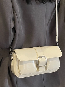 Chic cream white underarm bag with glossy patent leather and silver buckle
