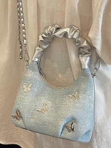 Light blue denim moon hobo bag with silver butterfly charms and rhinestone detailing