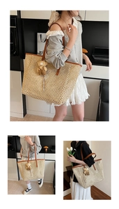 Detail of hollow-out woven straw tote bag with brown leather handles and plush bear charm